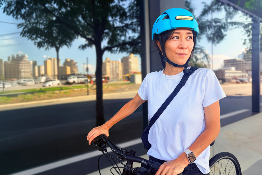 Sujene Kong, Co-Founder of FEND helmet, wearing FEND Super Plus helmet in color Hi-Vis Blue